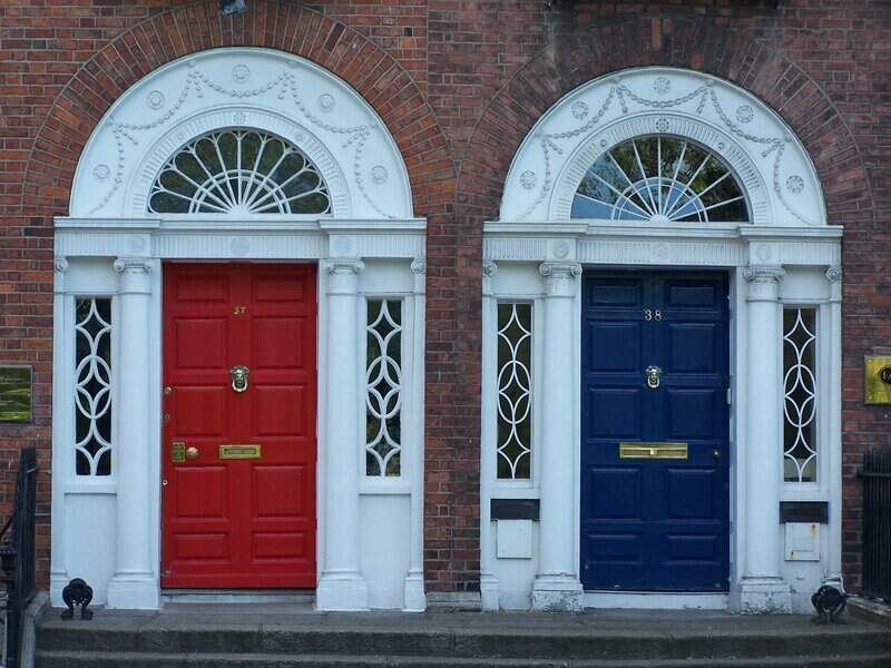 Two front door with red and blue paint